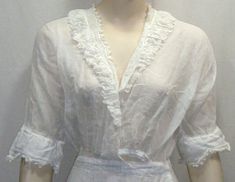 "Dresses of this age are extremely difficult to find and I have a few that I will be listing. White cotton lawn tea dress with lace ruffle down the front and back, sheer lace partial overskirt, lace trimmed ruffled sleeves, hook and eye closures down the side. Overall for its age this is in good condition. There is a snap that is missing on the front where it crosses over the waist but that's an easy fix. There is a tear on the bottom back of the cotton skirt that could be mended to look like a Edwardian Dress, Lawn Dress, Gibson Girl, Vintage Gowns, Edwardian Fashion, How To Make Clothes, Vintage Victorian, Ruffled Sleeves, Lace Ruffle