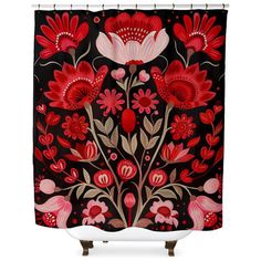 a black shower curtain with red flowers and leaves on it, against a white background