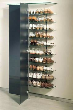 the shoe rack has many pairs of shoes on it