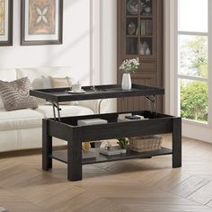 a living room scene with focus on the coffee table and end tables in the center