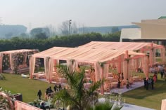 a group of people standing around a large tent