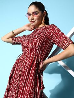 Maroon and white bandhani print fit and flare dressBoat neckShort, regular sleevesTie-up detailMidi length in flounce hem hemCotton fabric Bandhani Print, Printed Gowns, Wrap Midi Dress, Printed Sarees, Blouse Piece, Fit And Flare Dress, Boat Neck, Dresses Xs, Fit & Flare