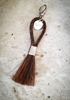 a key chain with a tassel on it