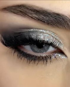 Black Eyeshadow Looks With Glitter, Siren Eyes Eyeshadow, Smokey Eyeliner With Glitter, Smokey Eye Makeup For Blue Green Eyes, Black Sparkly Eyeshadow, Grey And Silver Eyeshadow, Black And Silver Makeup Ideas, Silver Glitter Eyeliner Looks, Star Glitter Eye Makeup