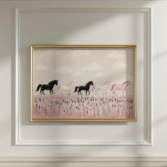 three horses in a field with pink flowers on the grass, framed in gold frame