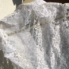 Gorgeous white lace romantic blouse. Lovely buttons! by Jürgen Michaelsen. Good vintage condition  Labelled size 38 Measurements (item lying flat on the ground, doubled for chest, waist and hips): Length on the back about 61 cm(  24.02 inches) Bust armpit to armpit  about  94 cm ( 37.01 inches) Waist about 86 cm (  33.86 inches) Arm from shoulder seam  cm (  inches) Shoulder width measured on the back about  cm (   inches) Bottom hem about 94 cm (  37.01 inches) Please note that the item is vintage and used! I always try to ship as fast as possible, processing the order normally takes up to 2 weeks , depending on my traveling schedule.  Please contact me if you have any questions about the item or shipping. Thank you for checking out my store! Feminine White Cotton Lace Top, Lace Top With Ruffles For Daywear, White Lace Top With Ruffles, Elegant White Blouse With Scalloped Lace, White Lace Collar Top For Daywear, Lace Tops With Scalloped Lace For Daywear, White Cotton Lace Top With Lace Collar, White Feminine Blouse With Delicate Lace, Feminine White Blouse With Delicate Lace