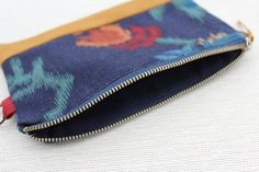 The perfect sized clutch purse to carry your phone, cash, cards, lip balm, keys and more. The zipper closure will keep your items safe and secure, yet easy for you to access!    Product features:- one of a kind- made from upcycled materials - fully lined- metal loop tab for easy attaching to other bags/belts- concealed French seams- durable finish  Size:7" - 4.5" Care instructions:Gentle machine or hand wash recommended when needed.  Please note: pattern placement of fabric may change. These clu Bohemian Cosmetic Bag With Zipper, Rectangular Shape, Bohemian Cosmetic Bag, Rectangular Zipper Pouch, Bohemian Rectangular Cosmetic Bag With Zipper, Bohemian Style Rectangular Cosmetic Bag With Zipper, Bohemian Rectangular Cosmetic Bag For Daily Use, Bohemian Cosmetic Bag For Daily Use, Bohemian Zipper Pouch Clutch For Daily Use, Bohemian Clutch With Zipper Pouch For Daily Use, Bohemian Clutch Pouch For Daily Use