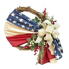 an american flag wreath with red, white and blue flowers on it's side