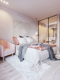 a bedroom with a large bed and white walls