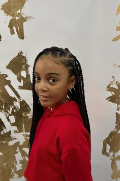 This charming hairstyle features symmetrical cornrows that start at the front and flow down smoothly into long braids. Each cornrow is neatly parted and decorated with small hair accessories that add a fun touch to the overall look. The hairstyle not only demonstrates excellent braiding skills but also provides a practical and fashionable choice for kids, - Click to see more of 20 Cute Cornrow Styles for Children and follow us for more hairstyle ideas. // Photo Credit: Instagram @pereira.braids