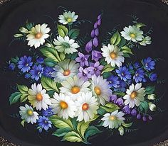 a black tray with flowers painted on it