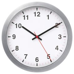 a close up of a clock on a white background with red hands and black numbers