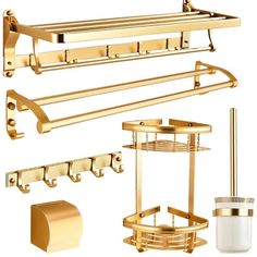 gold bathroom accessories including soap dispenser, toilet paper holder and towel rack