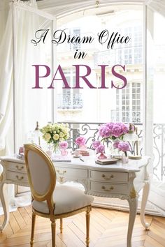 a white desk with flowers on top and the words dream office in paris above it