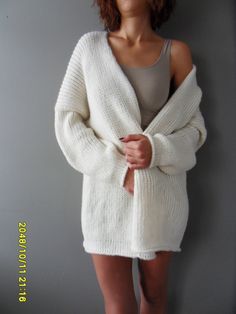 "Luxury, amazingly soft, oversized alpaca knit sweater cardigan . The pattern has relaxed fit with dropped shoulders. Color is off white. For colors available in pearl /light grey, black/charcoal, brown, crem/wheat, blue /green, burgundy, violet and pink click here https://www.etsy.com/ca/listing/187868895/alpaca-chunky-knit-woman-cardigan?ref=related-1 A new and exciting \"blow yarn\" made from soft 72% Baby Alpaca and cozy Merino wool. Its construction is unique, based on the newest yarn techn Cozy Long Chunky Knit Sweater, White Oversized Cozy Sweater, Oversized White Cozy Sweater, White Long Soft Knit Sweater, Long White Soft Knit Sweater, White Cozy Soft Knit Cardigan, White Chunky Knit Sweater Coat For Winter, Cozy White Soft Knit Cardigan, Oversized Soft Knit White Cardigan