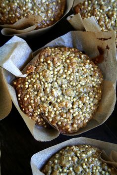 several muffins in paper cups on a table