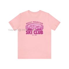 Introducing our exclusive Rocky Mountain Ski Club Graphic T-Shirt - the perfect fusion of comfort and style for winter lovers, skiing enthusiasts, and those who appreciate trendy apparel. Available in a variety of 10 vibrant colors, this T-shirt features a unique design on the front, showcasing the iconic Rocky Mountain ski club emblem, accompanied by a graphic of ski goggles and a stunning mountain landscape. Whether you're gearing up for a day on the slopes, embarking on an adventure, or simpl Sporty Graphic Print Winter T-shirt, Sporty Graphic Print T-shirt For Winter, Sporty Logo Print T-shirt For Outdoor Activities, Sporty T-shirt With Logo For Outdoor Activities, Sporty Top For Ski Season, Sporty Tops For Ski Season, Casual Graphic Print Tops For Winter Sports, Casual Graphic Print Top For Skiing, Sporty Crew Neck Skiing Tops