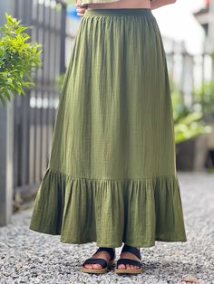 Casual Long Skirt With Ruffle Hem, Solid Cotton Bottoms With Ruffles, Long Ruffle Hem Relaxed Skirt, Cotton Pleated Tiered Maxi Skirt, Long Relaxed Skirt With Ruffle Hem, Green Tiered Ruffle Maxi Skirt, Spring Cotton Skirt With Ruffles, Long Skirt With Ruffle Hem And Relaxed Fit, Solid Color Ruffled Midi Skirt