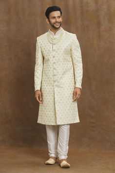 Cream sherwani with all over floral patterns and placed crystal embroidery.
Components: 1
Pattern: Embroidered
Type Of Work: Floral, Crystal
Neckline: Mandarin Collar
Sleeve Type: Full
Fabric: Silk Brocade
Color: Cream
Other Details: 
Straight silhouette
Closure: Front button
Note: Churidar and neckpiece worn by the model is not for sale
Occasion: Sangeet,Mehendi and Puja - Aza Fashions Cream Sherwani, White Sherwani, Sherwani For Men, Crystal Embroidery, Cream Silk, Silk Brocade, Zig Zag Pattern, Fashion App, Fabric Silk