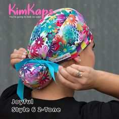 When this hat goes on your head, a smile will also go on your face! You’re going to love Joyful, a cute surgical scrub cap with happy flowers in every color of the rainbow, and a matching blocky coordinate. So cute with a turquoise ribbon for Style 6! You're going to look so cute! #soCute https://kimkaps.com/updates/new-rainbow-poppin-collection/ Surgical Scrub Hats Pattern Free, Roy G Biv, Scrub Hat Patterns, Scrub Caps Pattern, Stylish Scrubs, Surgical Caps Woman, Chasing Rainbows