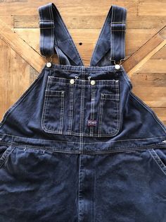 "There's no interior tags on these ol' Big Smith overalls and I provided measurements in the photos for an accurate fit. They best fit a XXL and can be adjusted into as long as 64\" In total length. They appear to have been worn cuffed for a long period of time as there's some distress at the lower legs. They're a deep indigo denim and are super soft, durable cotton with all the original hardware in tact and functioning shoulder adjustable straps and zip fly. These are well worn and have tons of character, please refer to the photos for an accurate reflection of the condition ✨(4)" Dark Wash Cotton Shortalls With Pockets, Dark Wash Relaxed Fit Shortalls With Pockets, Relaxed Fit Dark Wash Shortalls With Pockets, Utility Dark Wash Shortalls With Pockets, Retro Cotton Dark Wash Shortalls, Retro Dark Wash Cotton Shortalls, Utility Style Dark Wash Shortalls With Pockets, Vintage Cotton Medium Wash Shortalls, Vintage Cotton Denim Jumpsuit In Medium Wash