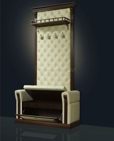 an upholstered chair is shown in front of a wall with a coat rack on it