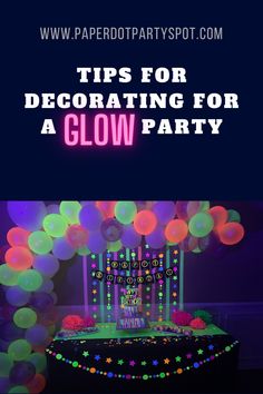 an image of a party with neon lights and decorations for a glow party on the table