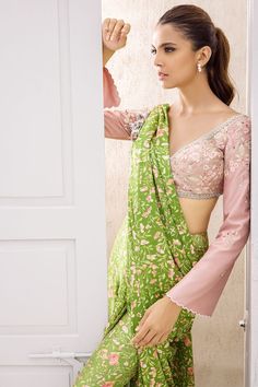 Embroidered Chalk Pink Blouse With Pear-Coloured Printed Floral Silk S – Sania Maskatiya International Traditional Pink Pre-draped Saree With Floral Embroidery, Pink Blouse With Mirror Work For Eid, Floral Embroidered Georgette Blouse With Traditional Drape, Pink Long Sleeve Blouse With Dupatta, Pink Floral Embroidered Pre-draped Saree For Eid, Eid Blouse With Floral Embroidery And Traditional Drape, Spring Festival Georgette Saree, Spring Georgette Saree, Pink Blouse With Dupatta In Traditional Drape