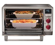 two casserole dishes are cooking in an open toaster oven with the door open