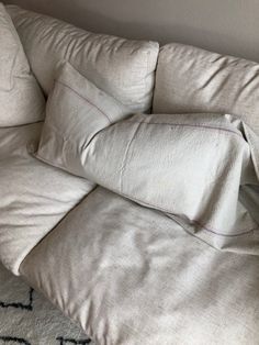 a couch with several pillows on top of it