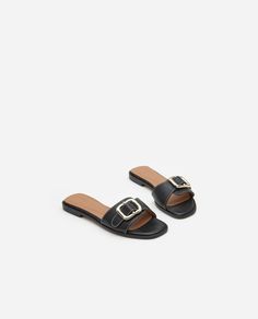 Mimi Leather Black – Flattered Spring Slides With Gold Buckle And Open Toe, Spring Open Toe Slides With Gold Buckle, Open Toe Slides With Gold Buckle For Spring, Elegant Sandals With Gold Buckle For Spring, Luxury Black Sandals With Rectangular Buckle, Elegant Sandals With Gold Buckle For Summer, Elegant Summer Sandals With Gold Buckle, Spring Leather Sandals With Gold Buckle, Open Toe Footbed Sandals With Gold Buckle For Summer