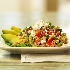 a white plate topped with vegetables and rice