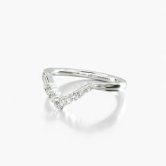 a white gold ring with diamonds on it