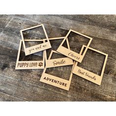 wooden cutouts with sayings on them sitting on top of a wood floor next to each other