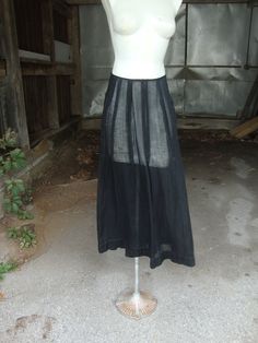 "This is a black cotton Edwardian or Victorian walking skirt. It opens in the back with hooks and eyes. There are stitched and released pleats front and back. There are a few small holes, easy repairs. Actually in very good shape for it's advanced age. Comes from a smoke free home. Measurements: Waist: 25\" Hip: 38\" Length: 37\" Please ask me any questions you may have before buying as this is a final sale. Please know your measurements and allow for movement. I ship within 3 business days of c Victorian Walking Skirt, Slack Pattern, Edwardian Skirt, Walking Skirt, Victorian Skirt, Heavy Winter Coat, 1970s Dresses, Milwaukee Wi, Cotton Blouses