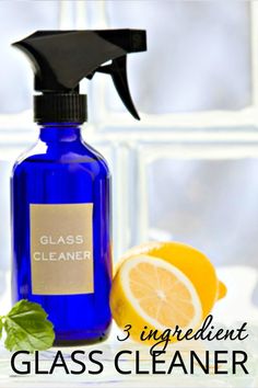 a blue glass cleaner bottle next to lemons and basil leaves with the words, i ingredient glass cleaner