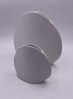 three white plates stacked on top of each other