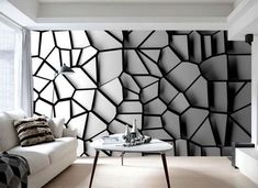 a living room with black and white wallpaper