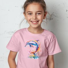 Kids Dolphin Shirt | Vibrant Watercolors Youth Dolphin T Shirt | Kids Dolphin Gift | Youth Dolphin Lover Tee | Cute Kids Dolphin TShirt Thank you for considering purchasing from Raven Printing Company.  We are based out of Cleveland, Ohio and would love to have the opportunity to earn your business. Because we are a small business we cannot accept returns or exchanges.  However if your product does not meet your standards please reach out and we would be more than happy to work with you on a sol Playful Colorful Crew Neck T-shirt, Colorful Playful Short Sleeve T-shirt, Playful Colorful Short Sleeve Top, Playful Multicolor Crew Neck T-shirt, Cute Colorful Short Sleeve T-shirt, Colorful Cute Cotton T-shirt, Cute Colorful Cotton T-shirt, Dolphin Shirt, Dolphin Gifts