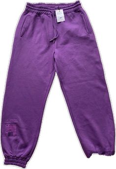 Purple Sweatpants For Spring Streetwear, High Waist Purple Pants For Streetwear, Purple High Waist Pants For Streetwear, Purple Athleisure Sweatpants With Elastic Waistband, Purple Relaxed Fit Sweatpants For Athleisure, Purple Relaxed Fit Sporty Sweatpants, Purple Cotton Athleisure Pants, Purple Bottoms With Elastic Waistband For Streetwear, Sporty Purple Sweatpants For Spring