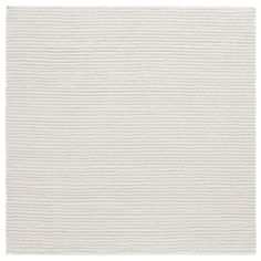 a white rug with wavy lines on it