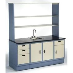 a blue and white kitchen cabinet with sink