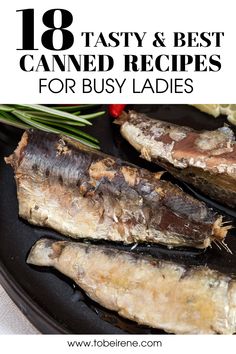 some fish are sitting on a plate with herbs