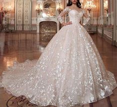 a woman in a wedding dress posing for the camera