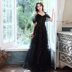 Black A-line Tulle Evening Dress, Black Tulle Dresses For Party Season, Black Tulle Dress For Party, Black Floor-length Dress With Sequins, Black Floor-length Party Gown, Black Prom Gown For Party Season, Black Gown For Prom Party Season, Black Gown For Prom And Party Season, Black Gown For Night Out Party Season