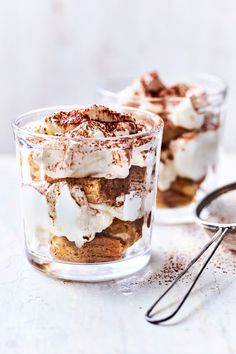 two desserts in small glass dishes on a table