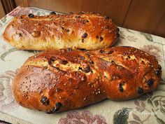 two loaves of bread sitting on top of a table