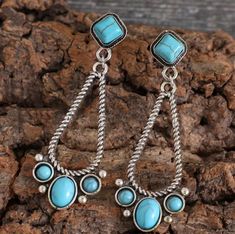 Silver-tone teardrop dangle earrings with faux turquoise accents featuring a post earring back. Southwestern Style Teardrop Dangle Earrings, Southwestern Nickel-free Teardrop Earrings, Southwestern Turquoise Teardrop Earrings, Turquoise Teardrop Chandelier Earrings For Pierced Ears, Acrylic Nails Almond Shape, Turquoise Dangle Earrings, Painted Hats, Silver Chain For Men, Buckles Fashion