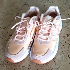 Brand New Ozelle Cloud Foam Technology Adidas Running Sneaker Shoes * White/Peach/Dusty Pink * Size 7.5/ 38 * Foam Technology * Pull On Style * Suede Details Sporty Peach Lace-up Sneakers, Peach Lace-up Sneakers For Sports, Peach Low-top Sports Sneakers, Adidas Pink High-top Running Shoes, Pink Adidas Running Shoes With Laces, Adidas Pink Low-top Running Shoes, Adidas Pink Sneakers For Jogging, Pink Adidas Running Shoes With Cushioned Footbed, Pink Adidas Running Shoes For Jogging