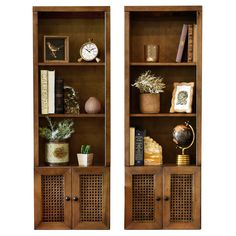 two wooden bookshelves with decorative items on them